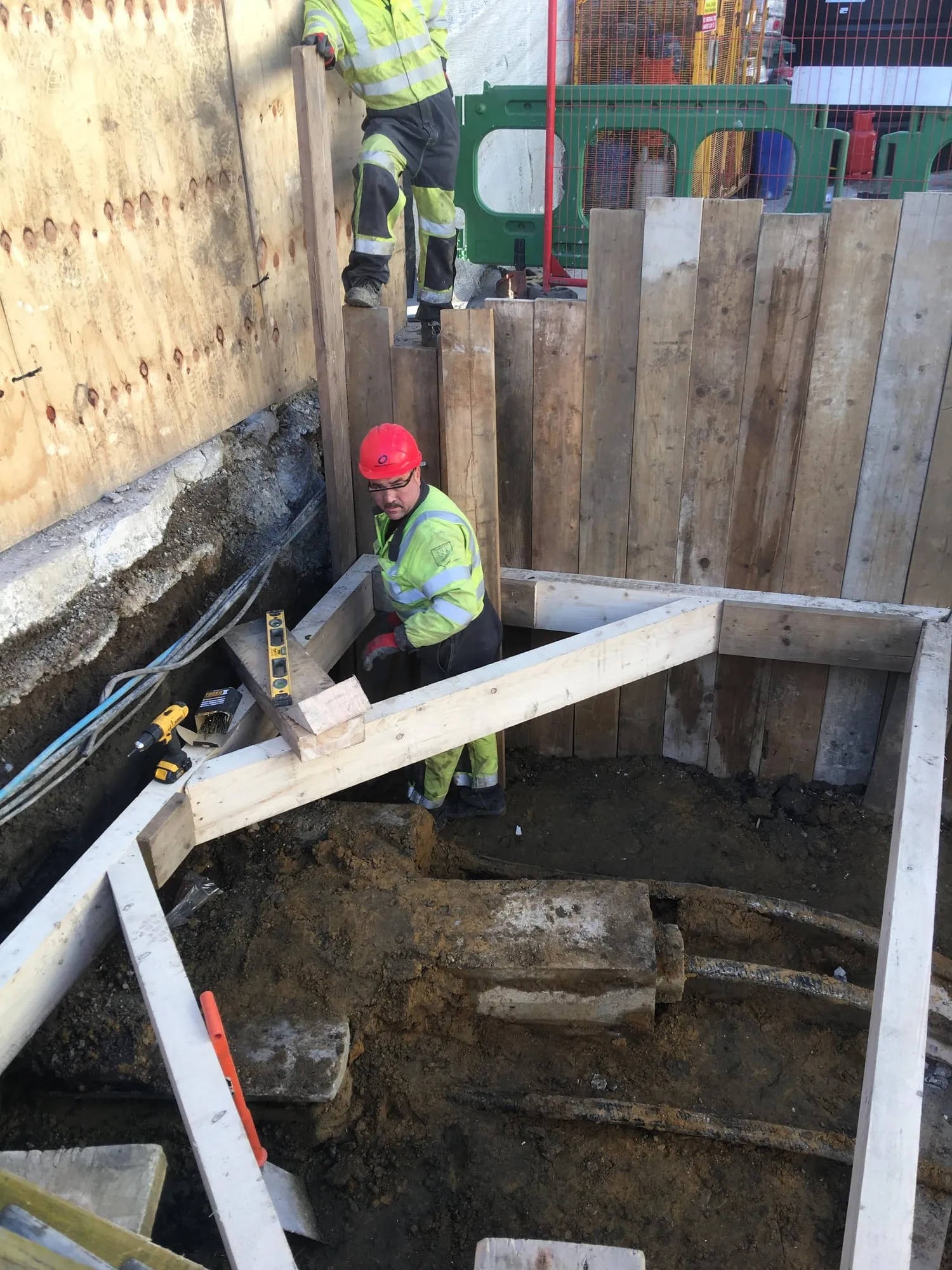 Timber trench support in a deep utility excavation